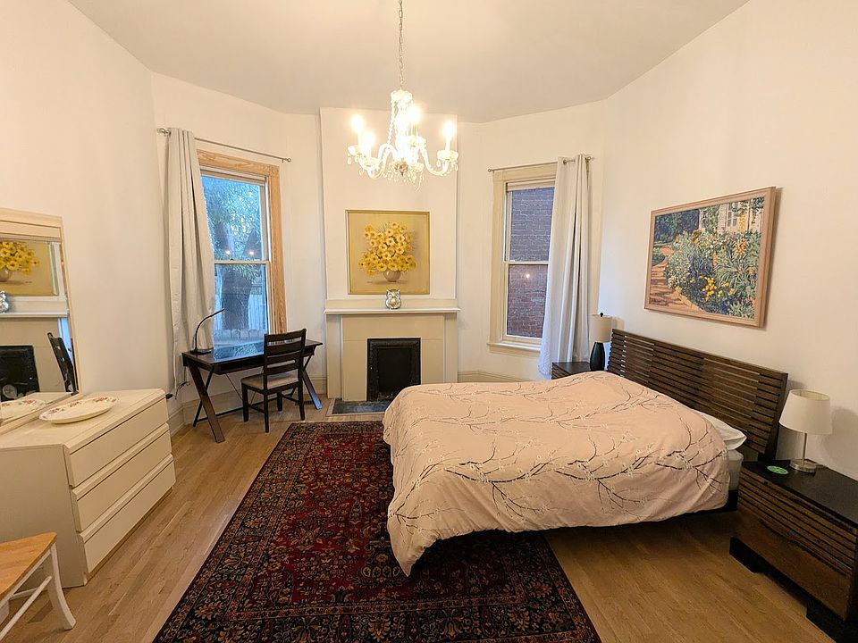 Bedroom 1 is large-14' x 14' with tall historic ceilings and windows.
