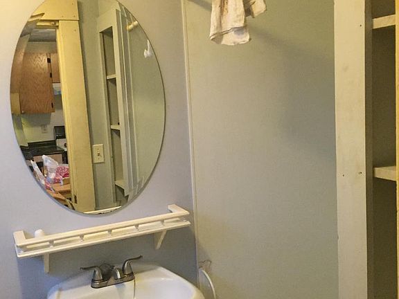 bathroom with shower stall (don't mind the dirty towel used