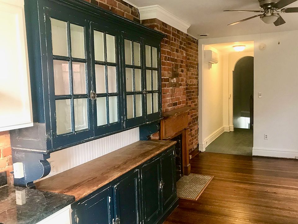 Original 1890 Storage Cupboard next to fireplace