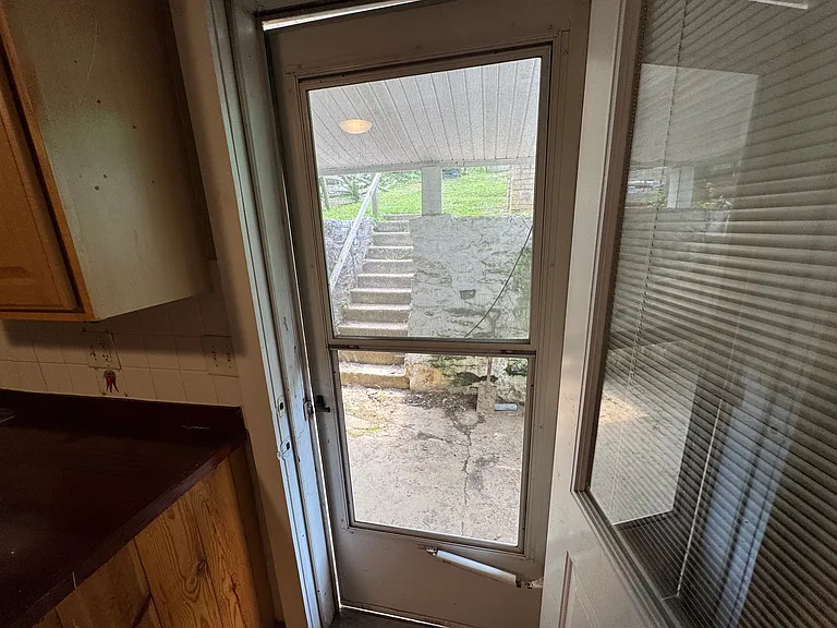 Kitchen door to backyard/patio