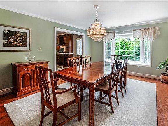 Formal dining room is accented by crown molding, two windows plus a bay window.