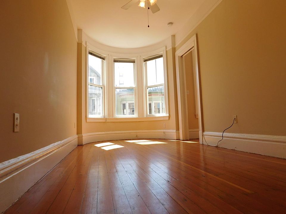 Sunny living room with beautiful bay windows
