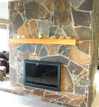 Custom Flagstone Slate work and Mantle. Double side Fireplace converted to gas.