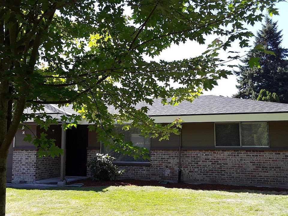 Front yard view of the home with new exterior paint and new roof.