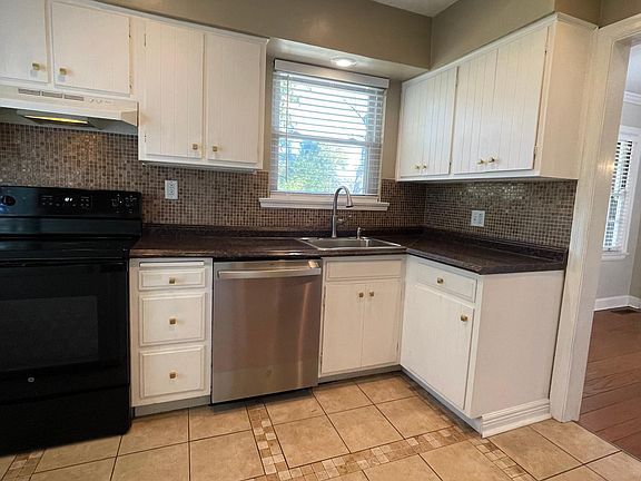 Kitchen with new stove and dishwasher