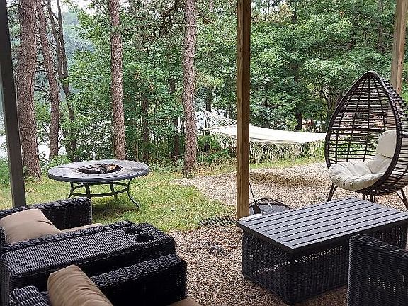 Covered sitting area under porch