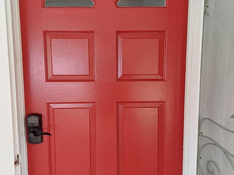 Beautiful front red door under large screened porch 
Our office does not use paypal, venmo, or apple pay - YOU MUST SEE US IN PERSON TO EXCHANGE ANY MONEY - be aware of scammers - you will talk to an employee of Kunes Real Estate in person.
