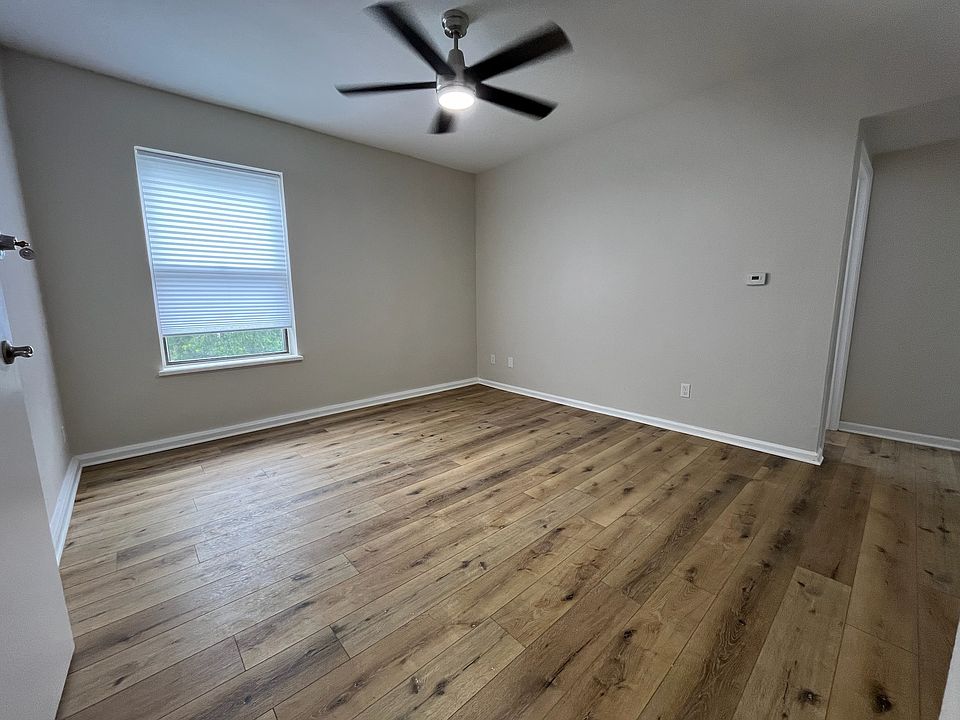 Living room. Brand-new programmable ceiling fan. All-new floors. Luxury insulating blinds.