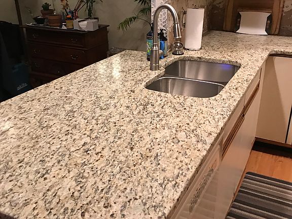 Leathered granite stainless steel sinks and a commercial style gad range with convection oven.