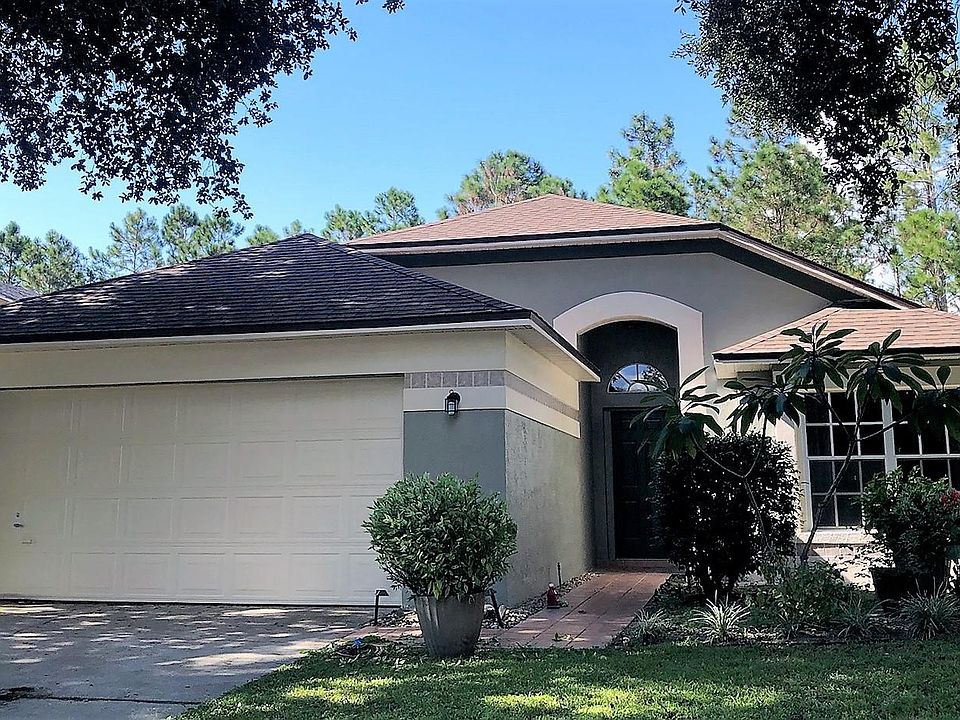 Newly painted exterior. Front entrance and two-car garage.