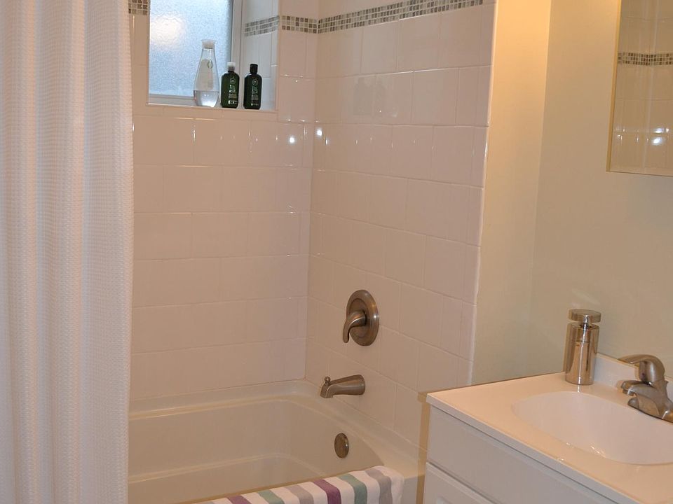 updated bathroom with tub and shower combo