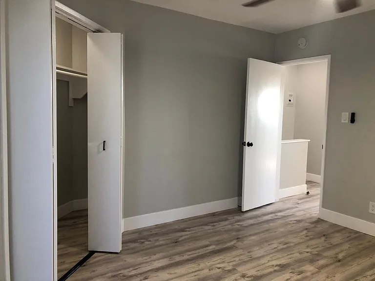 Bedroom #1 with area view, and shared balcony