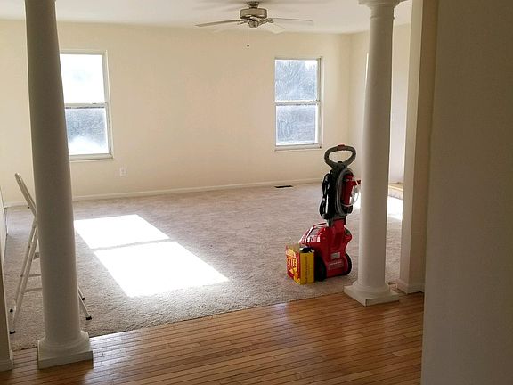 Pillarsfrom foyer into family room, lots of windows in back 