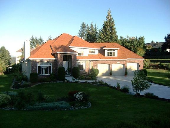 Exquisite four bedroom, two and a half bath home in gated Sunrise View Estates. Quality throughout w