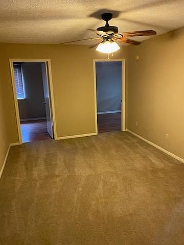 Upstairs game room with bedroom entrances