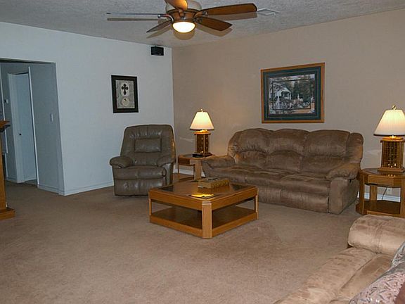 LARGE LIVING AREA HAS MOCK FIREPLACE, WHICH WILL REMAIN WITH HOUSE.