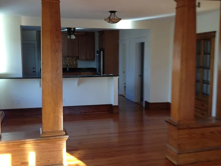 View of living room, dining room and kitchen