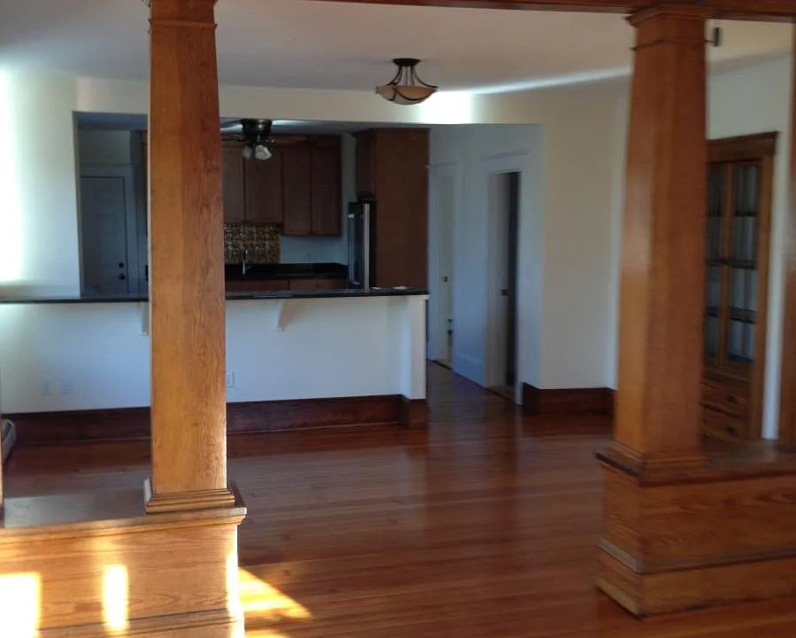 View of living room, dining room and kitchen