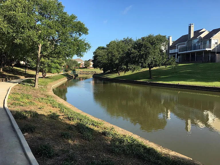 You can view the bridge in the far center which you can cross when you go out for a stroll along the canal. You can ride your bike or power walk on the canal sidewalk. Enjoy!