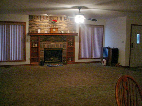 Fireplace with built-in shelving.