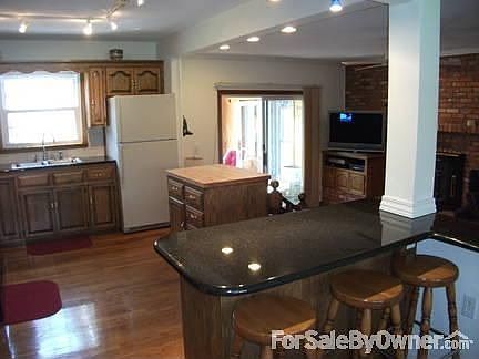 Rear view
						:
						Home is larger than it looks from the front. The 2 story sunroom has skylights.