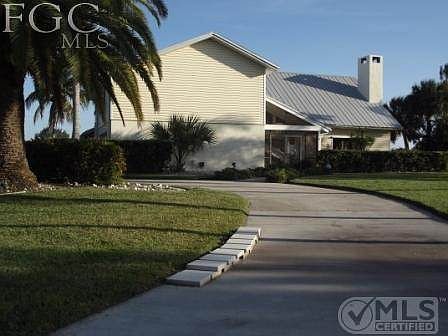 Front elevation, superb landscaping, circular driveway