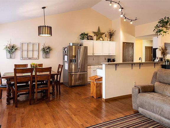 Updated kitchen open to the dining and family room with beautiful honey oak wood floors throughout.