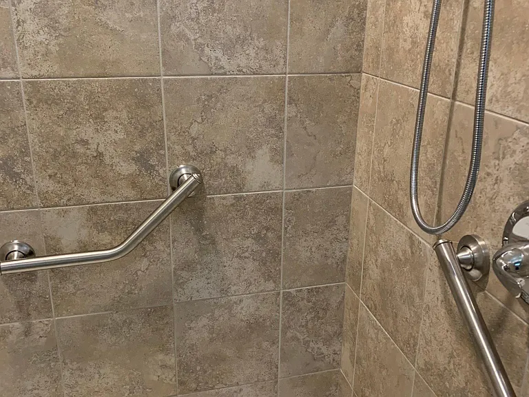 The walk-in shower in the Master Bathroom has ADA-height grab bars, making this single-level unit ideal for those with disabilities/mobility challenges.