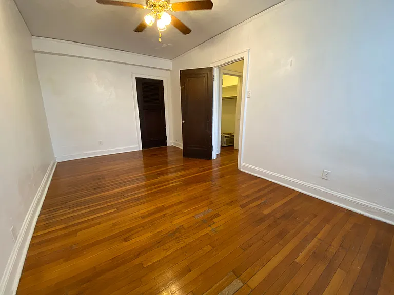 Warm wood floors add character and durability while complementing the apartment's historic charm.