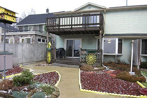 Rear deck & Patio offers Lake View! 