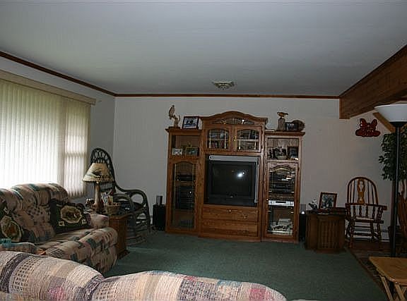 Large living rm w/ seperate dining room w/ slider's to oversized covered porch