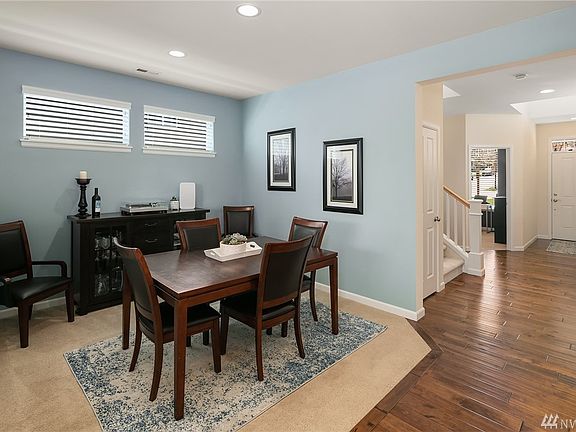 View of main entryway, den and formal dining room.