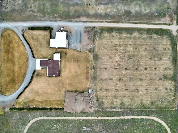 Arial view of property. Note the grass will be green soon as there is irragation throughout the property. The back half is havested by local farmer for alph-alpha if your interested in continuing the arrangement. Large garden space and fruit trees also on the property. 