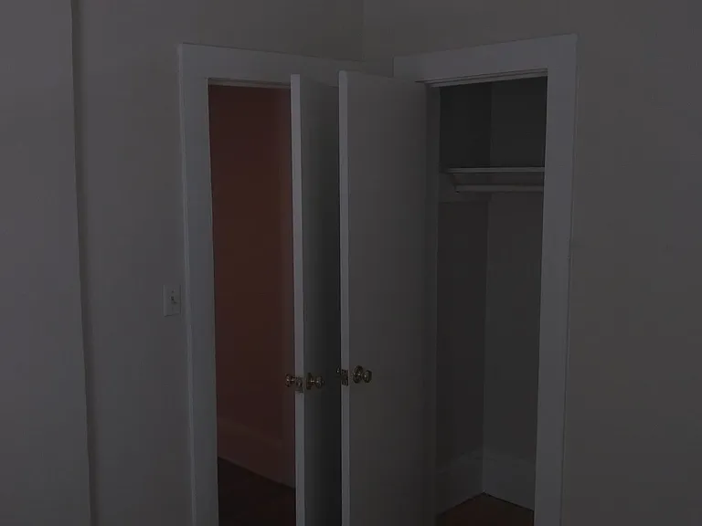 Second bedroom - entry door and storage closet.
