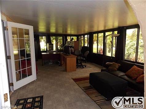 Large Home Office with 462 sf of area. Room has lots of sliders