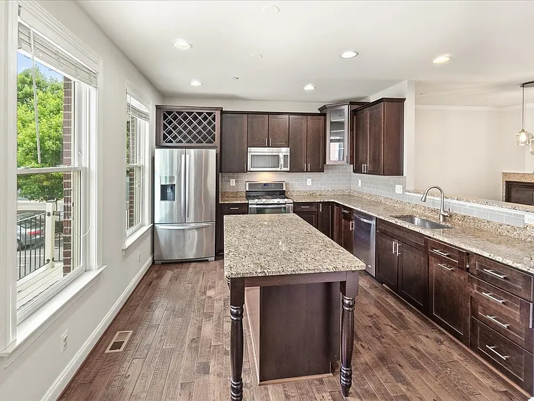 Gourmet Kitchen with Granite countertops, stainless appliances, wine rack with ample storage