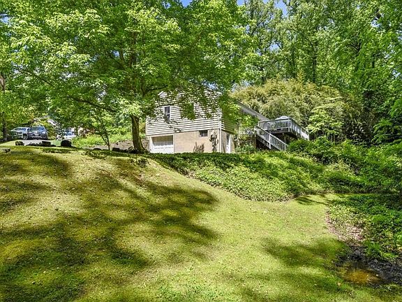 View of garage and side of house and side yard.