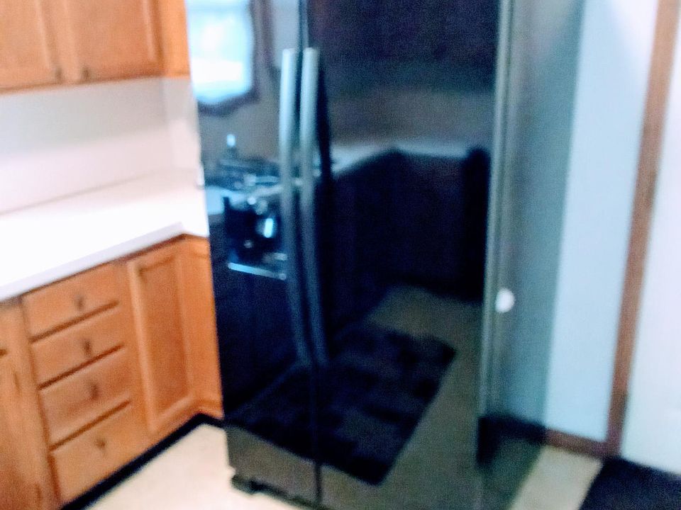 Whirlpool side by side refrigerator with ice & water in door