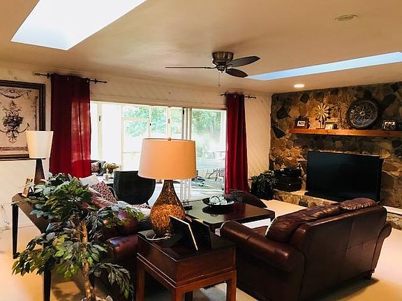 Living room overlooks pond and park