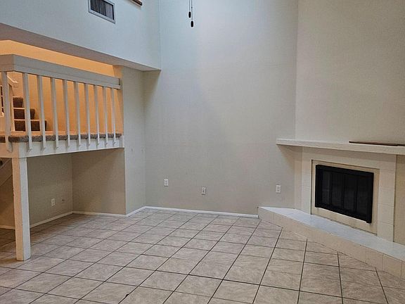 VAULTED CEILING WITH SKY LIGHT IN LIVING ROOM AREA