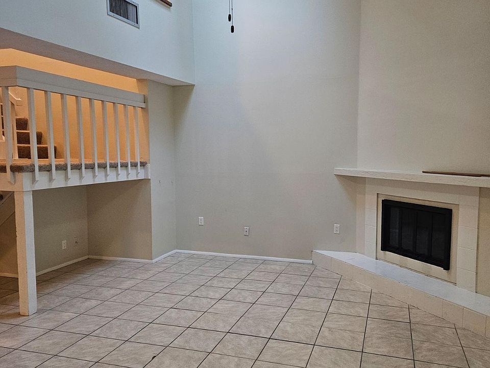 VAULTED CEILING WITH SKY LIGHT IN LIVING ROOM AREA