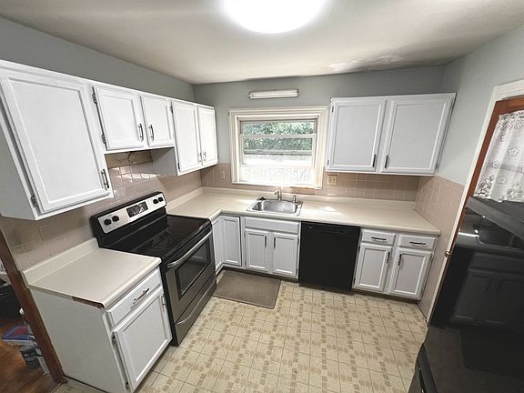 Upgraded new kitchen! Freshly painted cabinets and very soon to be replaced counter top and brand new slim microwave to be mounted! For all your kitchen needs!
