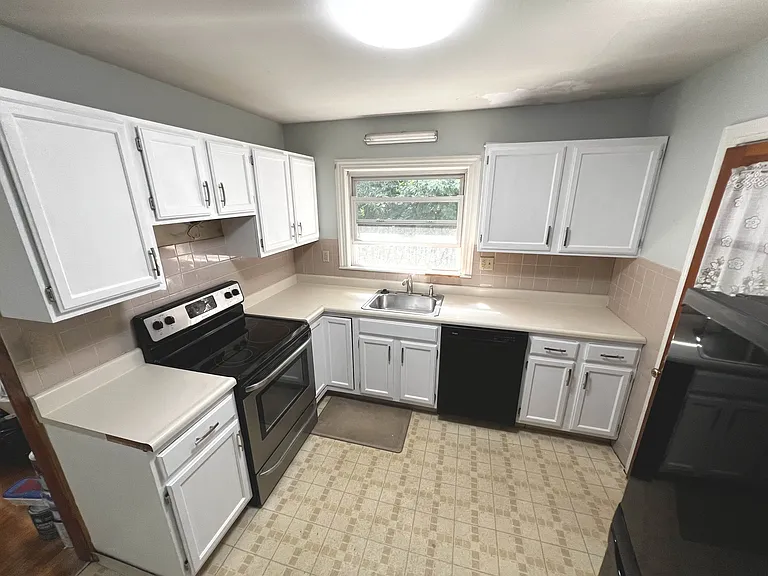 Upgraded new kitchen! Freshly painted cabinets and very soon to be replaced counter top and brand new slim microwave to be mounted! For all your kitchen needs!
