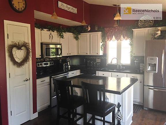 Kitchen with Granite countertops, tile backsplash, stainless ste