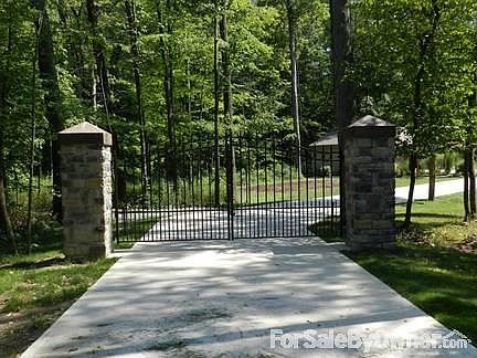 Gated entrance with key pad and remote controls for the cars.