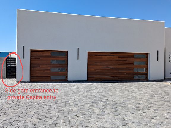 Lighted, key pad coded side gate entry to private casita entrance and outdoor space.