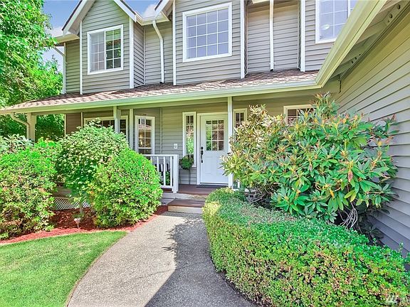 Beautiful entry with deck that has just been freshly painted and stained
