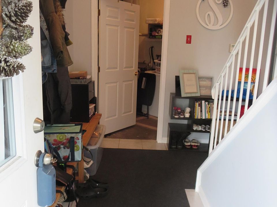 entrance from front door straight ahead is washer/dryer room