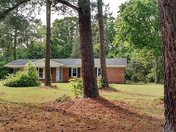 View from street. Nice front yard with trees. Additional yard space in back