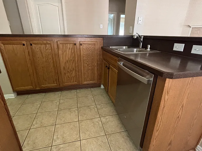 Sink, Dishwasher, High bar area. Lots of Cabinets!!